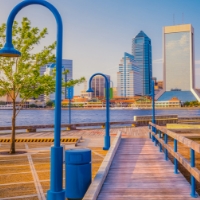 A photo of north and south bank riverwalk looking out onto downtown Jacksonville.