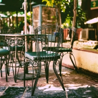 An outdoor dining setup with a table and chairs in the San Marco neighborhood