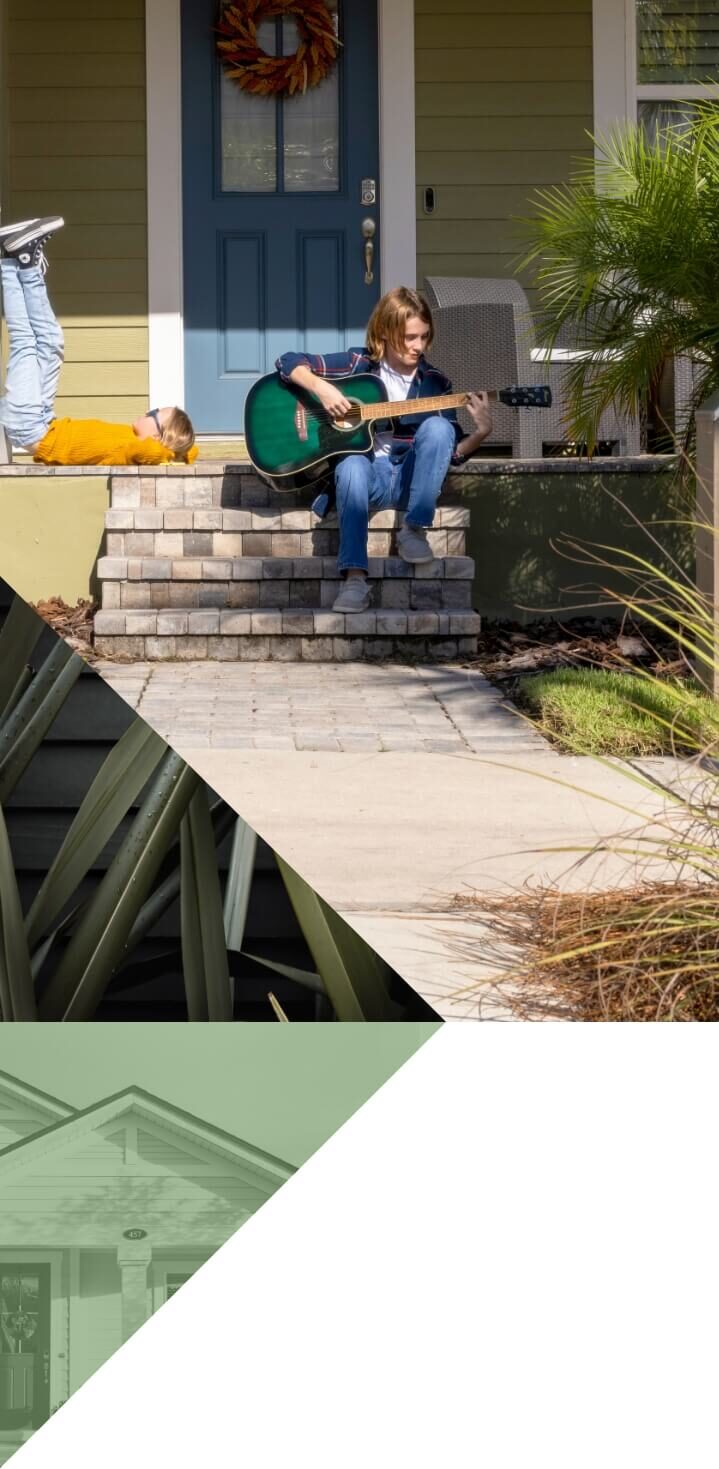Collage of two pictures. A young brother and sister on a front porch with a blue front door surrounded by greenery. The boy is playing a green guitar on the steps and the girl laying with her legs up against a white column. Second picture is green tropical leaves with raindrops in front of a charcoal background.