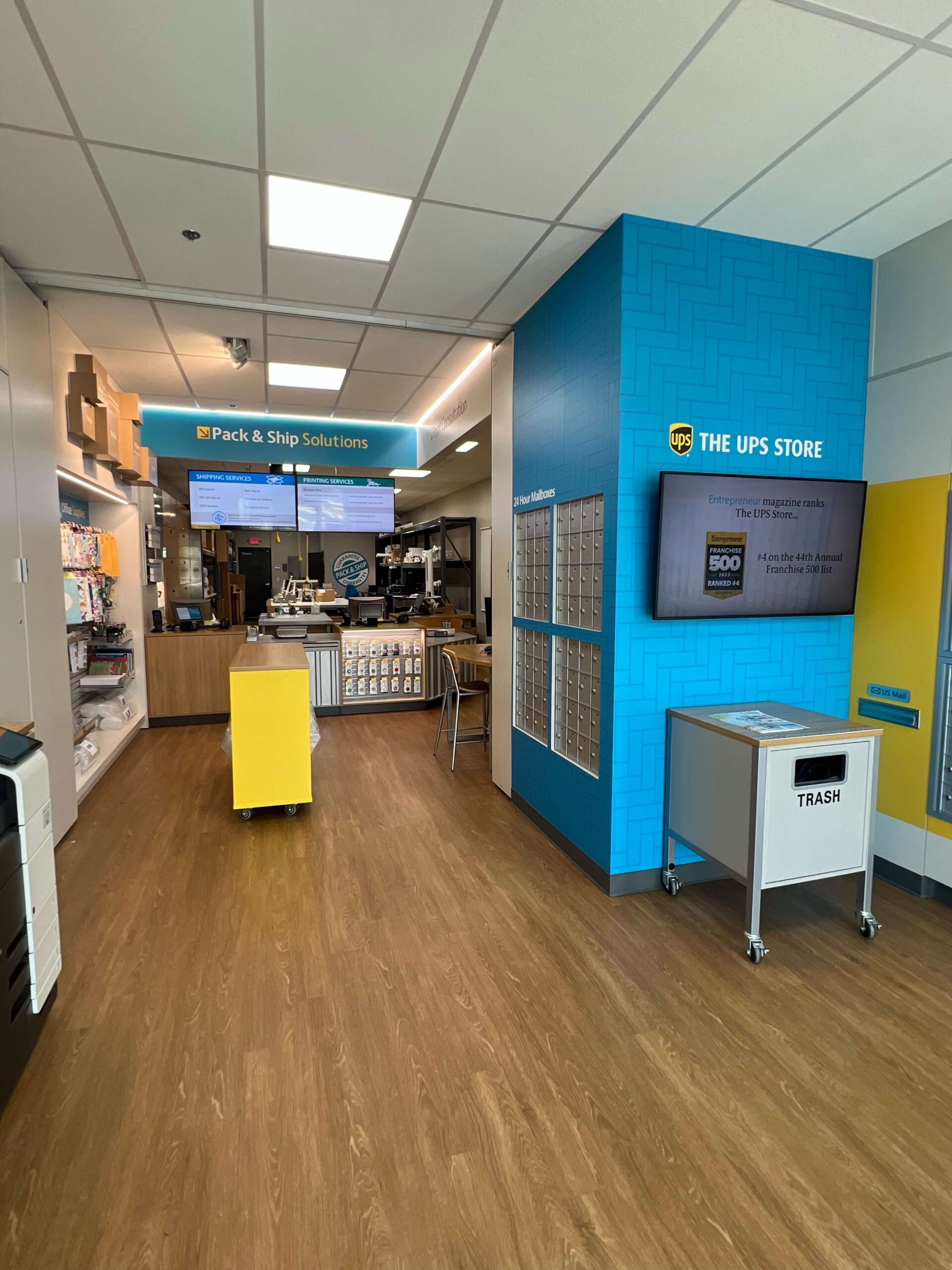 The interior of a store with blue and yellow walls.