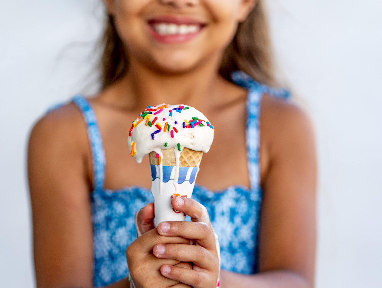 Girl holding ice cream cone in Wildlight