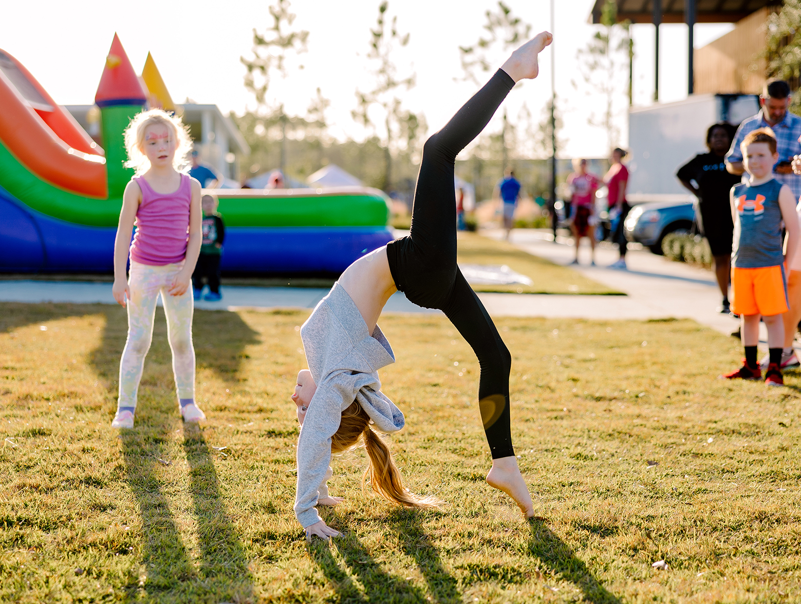 Girl practices gymnastics at lawn in Wildlight.