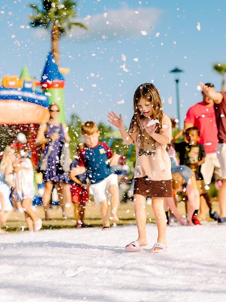 A group of children playing in the snow.