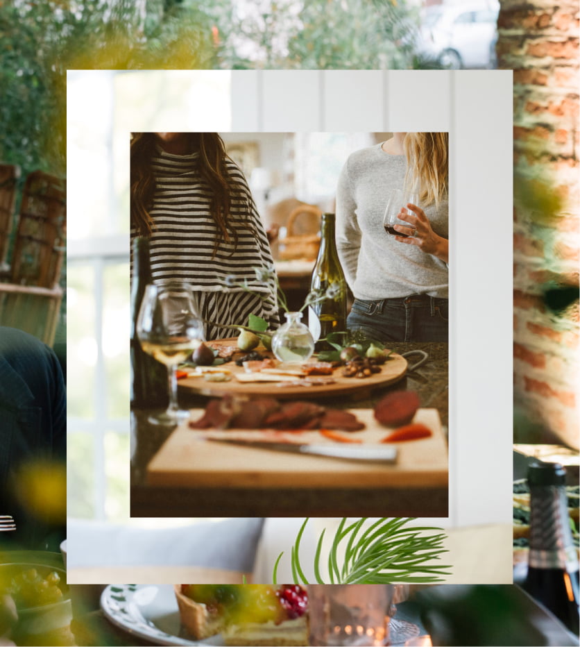 Having wine over a party hor d'ouvres spread on a table