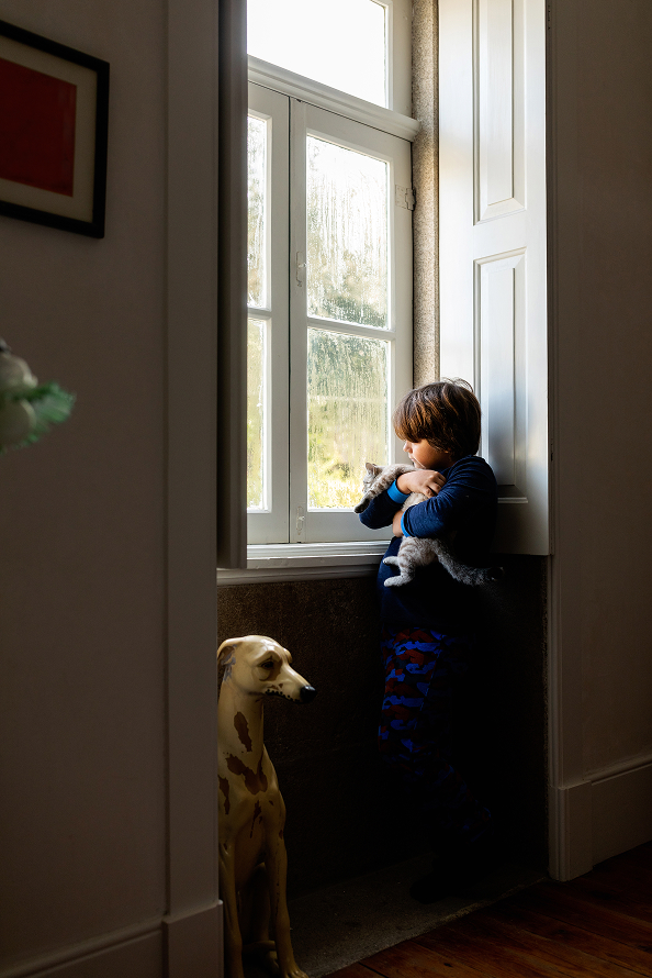 Boy looking our window