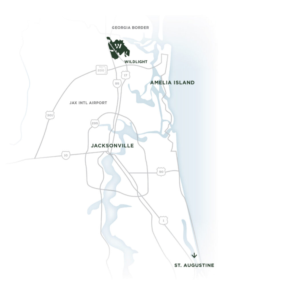 A simplified map showing Jacksonville, Jax Intl Airport, Amelia Island, the Georgia border, St. Augustine, and a highlighted area labeled Wildlight Florida—perfect for discovering homes in Nassau County Florida.