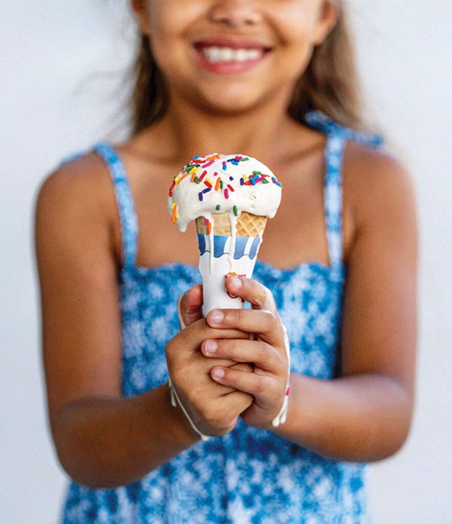 Little girl holding ice-cream cone