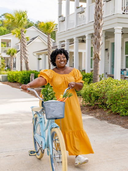 Woman walking her bicycle