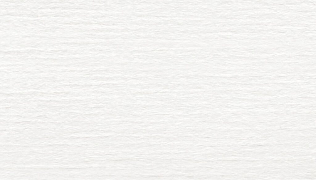 Close-up of a blank, textured white paper surface with subtle horizontal lines and slight variations in shading—perfect for sketching ideas for homes in Nassau County Florida or planning your dream life in the Wildlight Yulee Florida community.