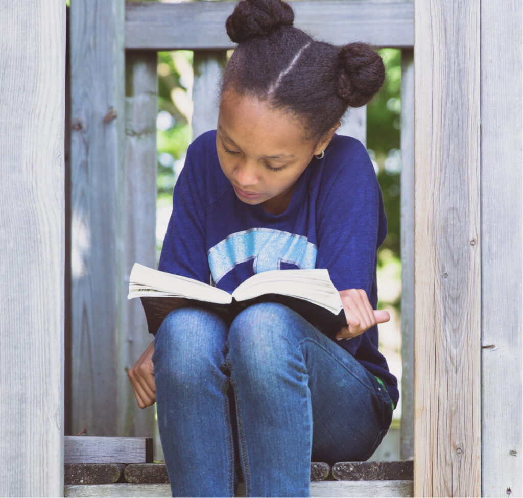 Young girl reading book