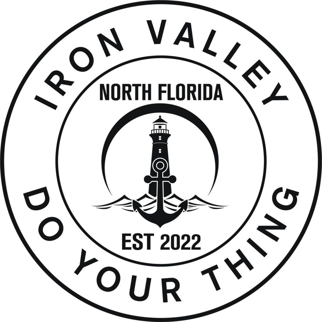 Circular logo with text "IRON VALLEY DO YOUR THING," featuring a lighthouse, anchor, waves, crescent shape, and "NORTH FLORIDA EST 2022" in the center—reflecting the spirit of the Wildlight Yulee Florida community.