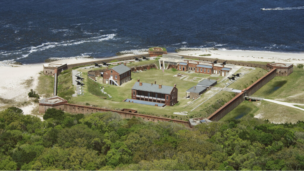 Aerial view of a coastal brick fort with central buildings, cannons along the walls, and surrounding beach and water—just a short drive from homes in Nassau County Florida and the Wildlight master planned community.