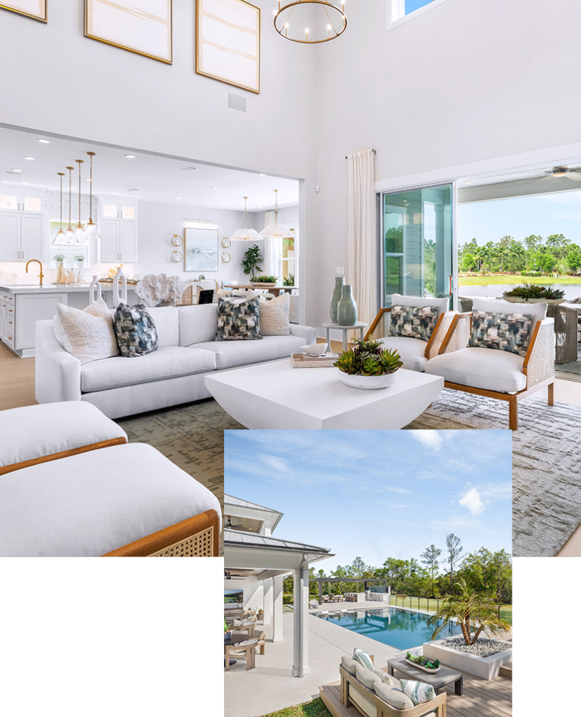 Modern living room with white furniture and large windows, opening to a patio with outdoor seating and a view of a pool and trees.